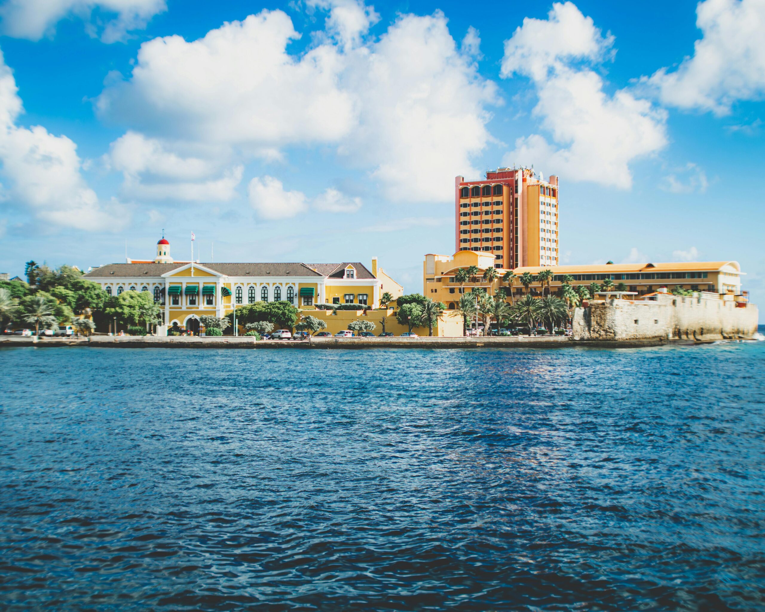 Colorful architecture along the Willemstad waterfront, highlighting Curaçao's unique urban landscape.